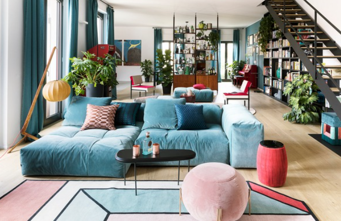 Modern senior center living room with a blue sofa and high contrast interior